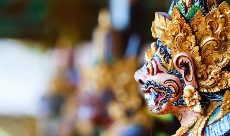 Close up of a traditional Balinese God statue in Bali temple